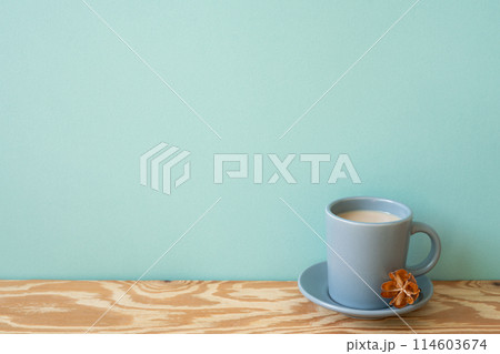 Cup of latte coffee on wooden table. mint wall background 114603674