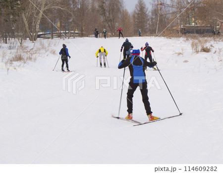 Teenage skiers in the snowy forest Park 114609282