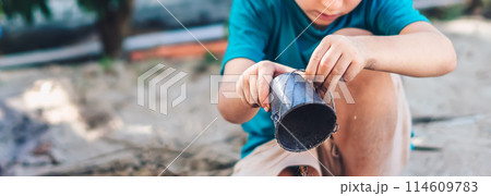 Child playing in sandbox. Happy childhood freedom creativity development, tactile Nature sensations Child playing in sandbox. Happy childhood freedom creativity development, tactile Nature sensations 114609783
