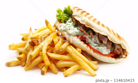 an artisan juicy gyros with sauce, surrounded by golden and french fries on a white background 114610415