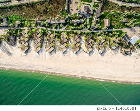 beach with houses on the coastline 114610581