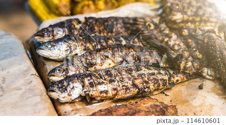 tasty grilled fish on table tasty grilled fish on table 114610601