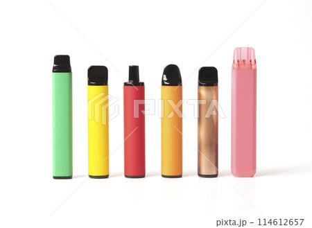 A set of colorful disposable electronic cigarettes of different shapes on a white background with smoke. Concept of modern smoking, vaping and nicotine. A set of colorful disposable electronic cigarettes of different shapes on a white background with smoke. Concept of modern smoking, vaping and nicotine. 114612657