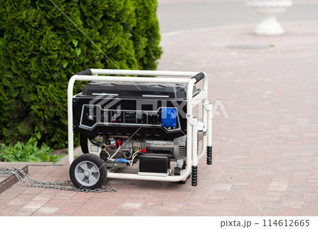 Power supply generator placed on street sidewalk. outdoor diesel power generator in Ukraine. Power supply generator placed on street sidewalk. outdoor diesel power generator in Ukraine. 114612665