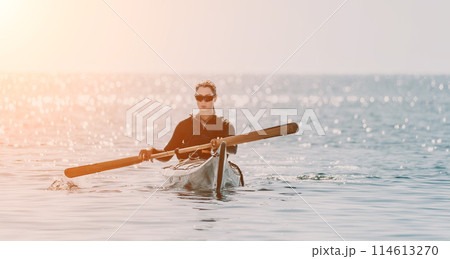 Woman sea kayak. Happy smiling woman in kayak on ocean, paddling with wooden oar. Calm sea water and horizon in background. Active lifestyle at sea. Summer vacation. 114613270