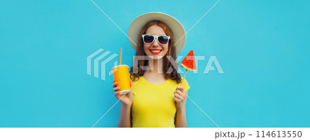 Summer portrait of happy woman with cup of juice and sweet lollipop watermelon on blue background 114613550