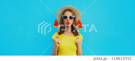 Summer portrait of stylish young woman with juicy lollipop or ice cream shaped slice of watermelon Summer portrait of stylish young woman with juicy lollipop or ice cream shaped slice of watermelon 114613552