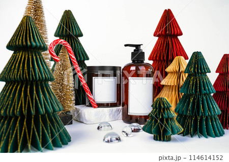 dark jar with lid and dispenser on the background of Christmas decorations, side view 114614152