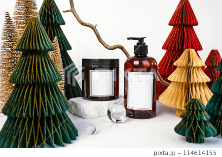dark jar with lid and dispenser on the background of Christmas decorations, side view dark jar with lid and dispenser on the background of Christmas decorations, side view 114614155