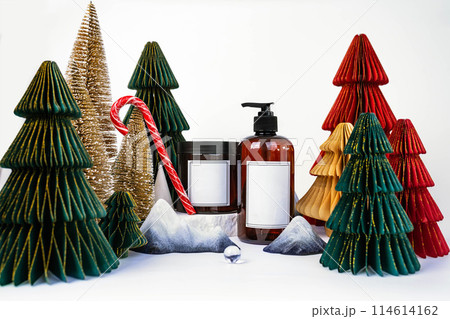 dark jar with lid and dispenser on the background of Christmas decorations, side view dark jar with lid and dispenser on the background of Christmas decorations, side view 114614162