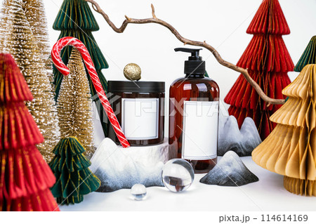 dark jar with lid and dispenser on the background of Christmas decorations, side view dark jar with lid and dispenser on the background of Christmas decorations, side view 114614169