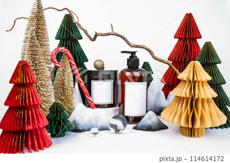 dark jar with lid and dispenser on the background of Christmas decorations, side view 114614172