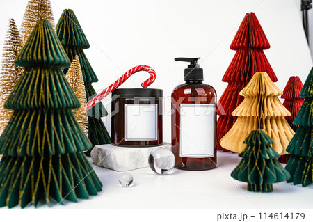 dark jar with lid and dispenser on the background of Christmas decorations, side view dark jar with lid and dispenser on the background of Christmas decorations, side view 114614179