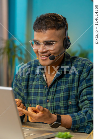 Business man wearing headset freelance worker call center or support service operator helpline 114614369