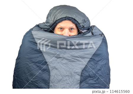 bearded man in a sleeping bag on a white background. equipment for recreation in tourism and travel bearded man in a sleeping bag on a white background. equipment for recreation in tourism and travel 114615560