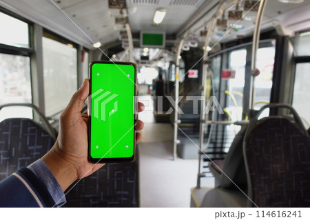 passenger sitting in a bus using his phone with green screen passenger sitting in a bus using his phone with green screen 114616241