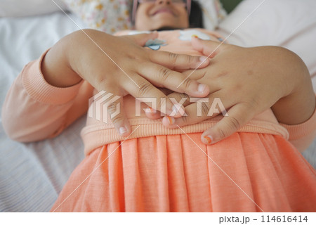 child suffering stomach pain close up. child suffering stomach pain close up. 114616414