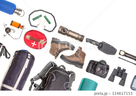 Set of tourist trekking items on white background. Top view of accessories for travel 114617153