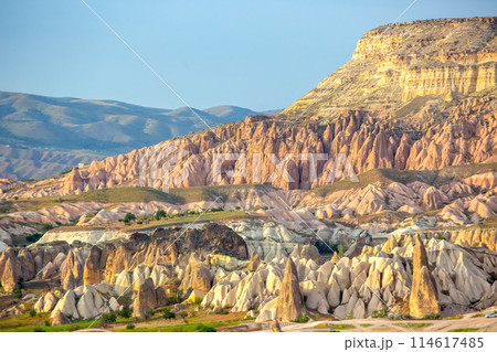 Volcanic rocks and limestone cliffs in Cappadocia valley. Turkey. Tourism and travel. 114617485
