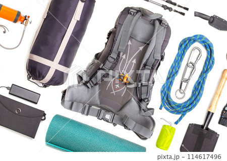 Set of tourist trekking items on white background. Top view of accessories for travel. 114617496
