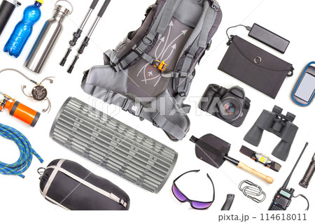 Set of tourist trekking items on white background. Top view of accessories for travel. 114618011