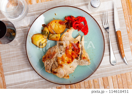 Pork secret served with potatoes and peppers 114618451