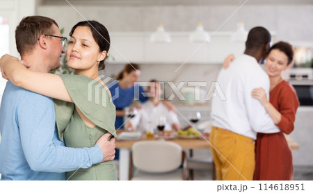 Happy middle-aged men and women doing slow dance in pairs 114618951