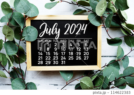 July 2024 monthly calendar monthly calendar on wooden chalkboard background for planning and management July 2024 monthly calendar monthly calendar on wooden chalkboard background for planning and management 114622383