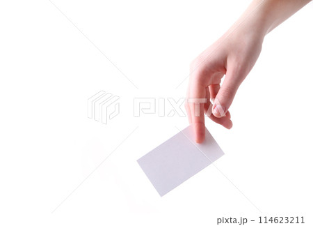 Woman holding white business card in hand isolated on a white background. 114623211