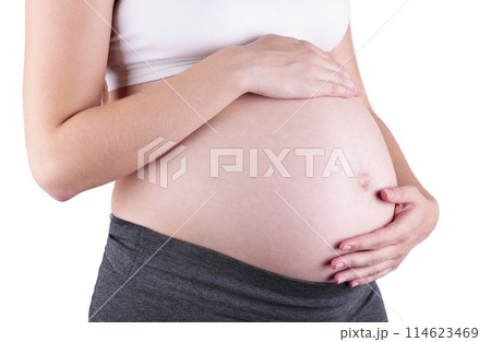 A cute pregnant belly isolated on a white background 114623469