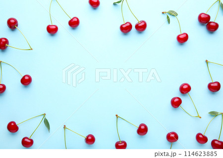 Cherry pattern. Flat lay of cherries on a blueの写真素材