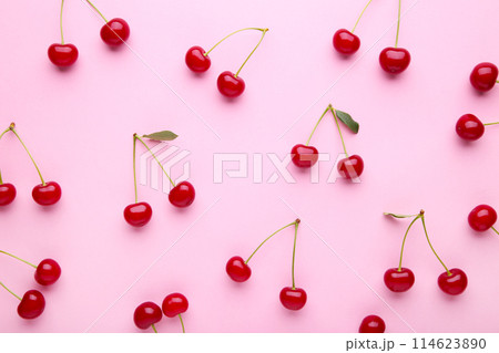 Cherry pattern. Flat lay of cherries on a pink background.Top view Cherry pattern. Flat lay of cherries on a pink background.Top view 114623890