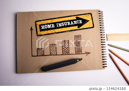 Home Insurance. Direction arrow with text on office desk 114624388