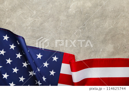 American flag on grey concrete background with copy space 114625744