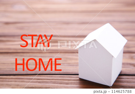 Stay at home to reduce risk of infection and spreading the virus. Save planet from corona virus. Stay safe, stay inside home. Composition on blue background 114625788