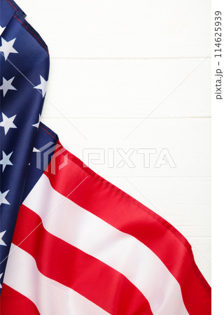 American flag on white wooden background with copy space 114625939