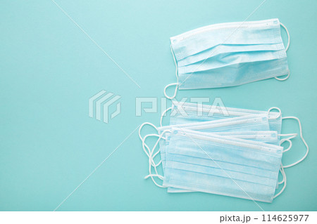 Medical masks on a blue background with copy space. Coronavirus 114625977