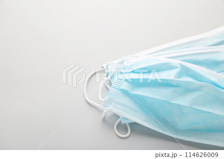 Medical masks on a grey background with copy space. Coronavirus Medical masks on a grey background with copy space. Coronavirus 114626009