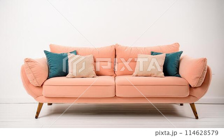 Peach color sofa with pillows 114628579