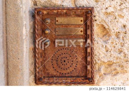 vintage intercom on weathered stone wall vintage intercom on weathered stone wall 114629841