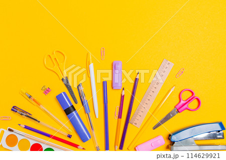 Composition of office supplies on yellow background. Flat lay. Concept of back to school Composition of office supplies on yellow background. Flat lay. Concept of back to school 114629921