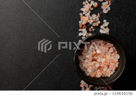 Colored Himalayan salt on a black background. Straight line Space for text Colored Himalayan salt on a black background. Straight line Space for text 114630156