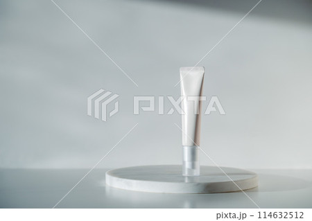 Blank white cream tube on marble white background 114632512