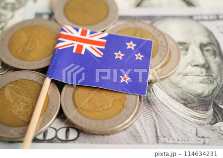 New Zealand flag on coin and banknote money, finance trading investment business currency concept. New Zealand flag on coin and banknote money, finance trading investment business currency concept. 114634231