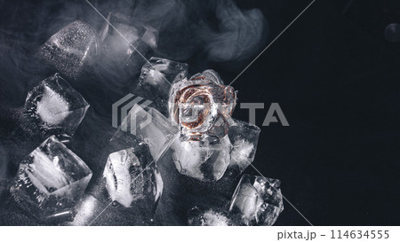 frozen rings in ice with water and smoke on black background frozen rings in ice with water and smoke on black background 114634555