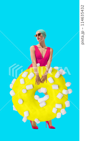Young woman in pink swimsuit with yellow donut covered in marshmallows against bright blue background. Contemporary art collage. 114635432