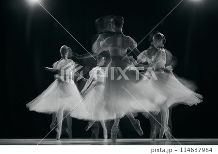 Graceful movements of four young dancers captured in ghostly blur, showcasing fluidity and beauty of ballet. 114637984
