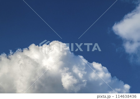 Blue sky with puffy white clouds in bright clear sunny day 114638436