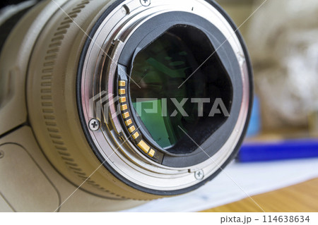 Close up of camera lens on blurred background. 114638634