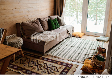 No people wide shot of cozy living room interior in modern wooden country house, copy space No people wide shot of cozy living room interior in modern wooden country house, copy space 114641057